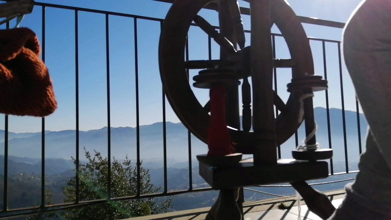 Spinning yarn on my balcony in summer